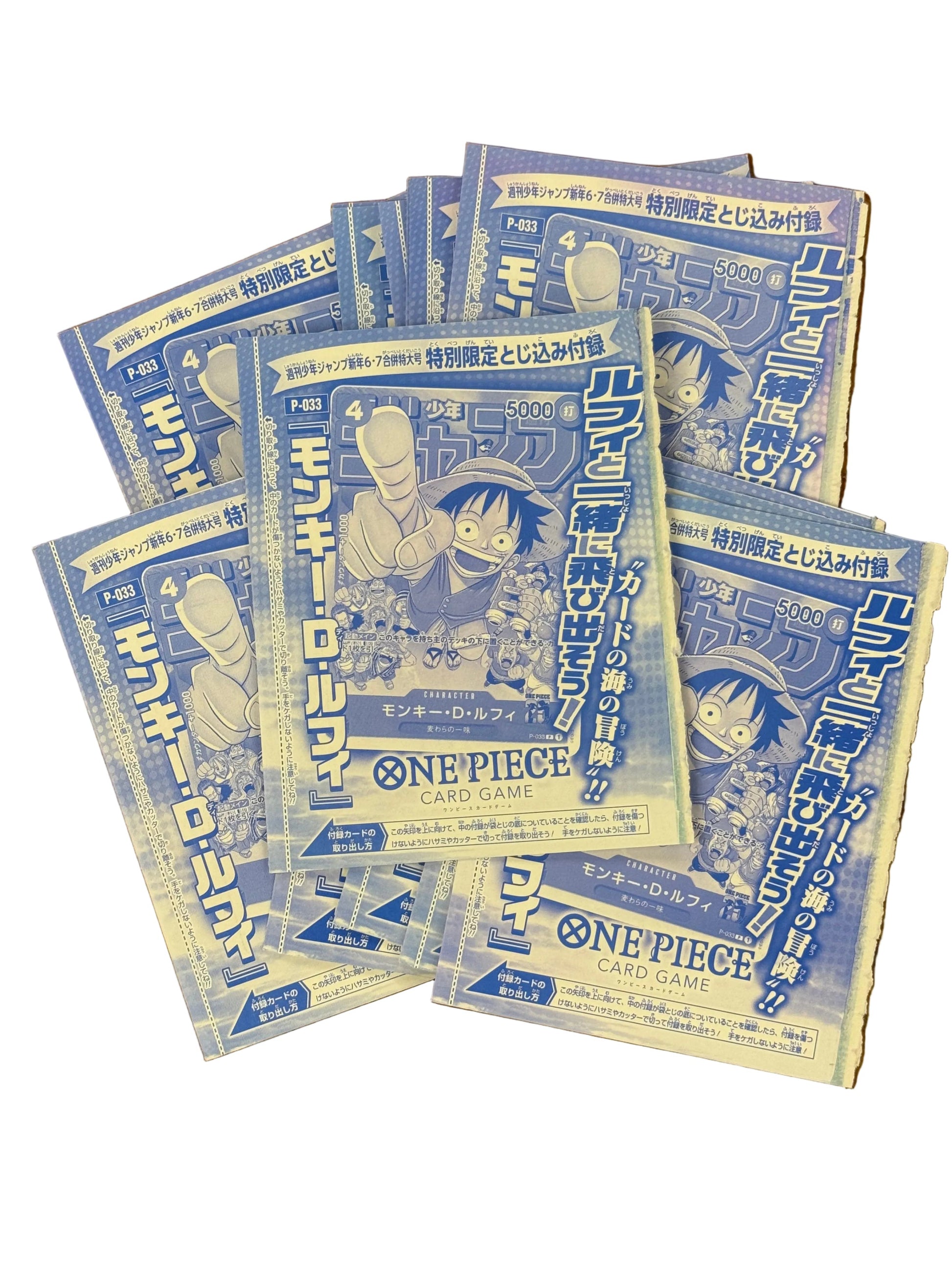 Multiple promo packs of One Piece card game on a white background